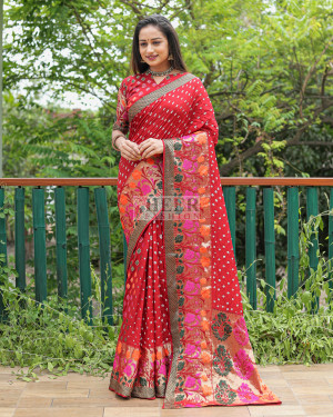 Red color bandhej silk saree with zari weaving work