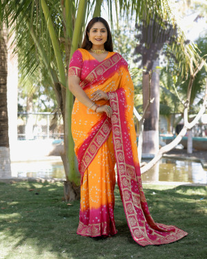 Orange and pink color bandhej silk saree with zari weaving work
