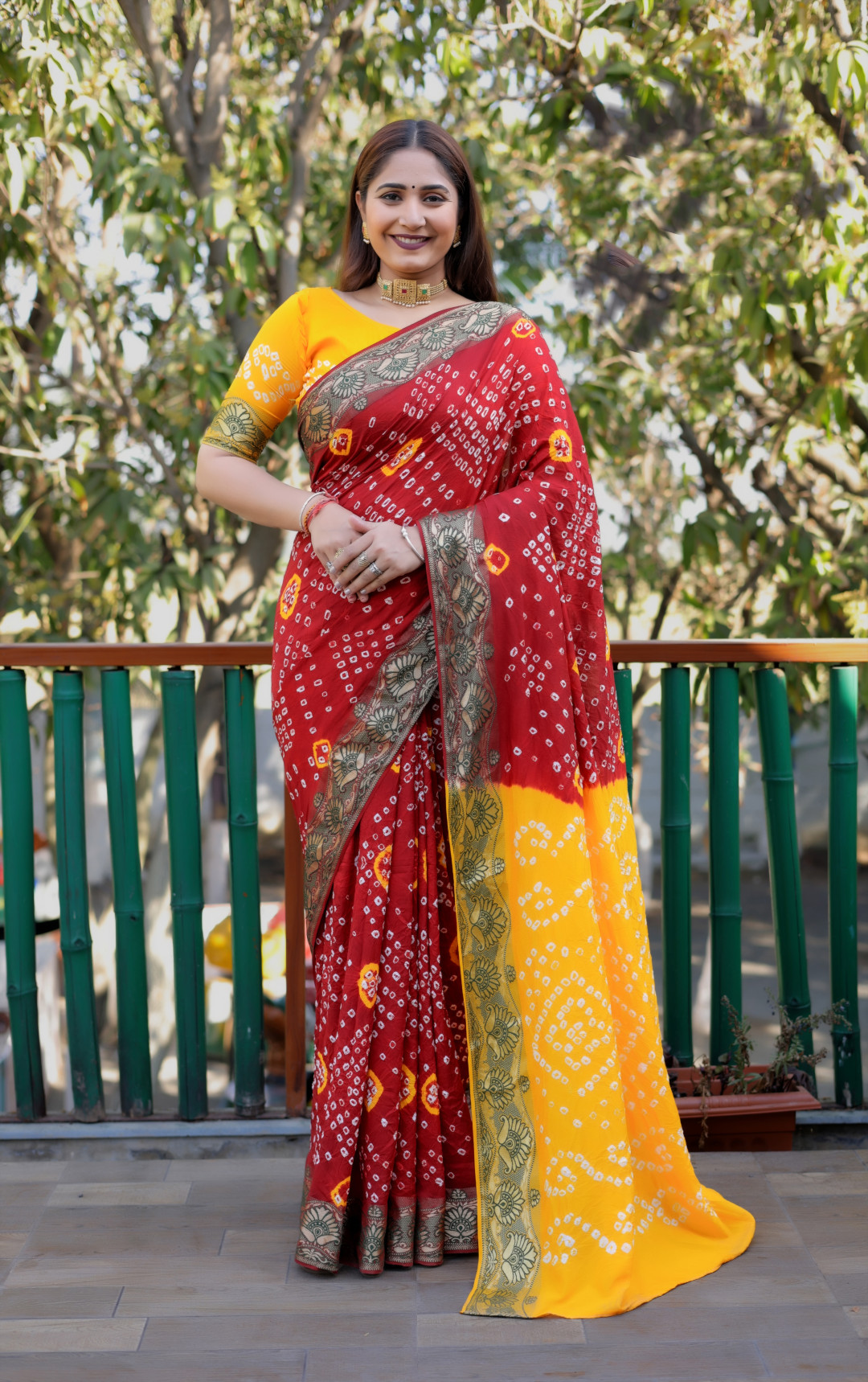 Red color bandhej silk saree with zari weaving work