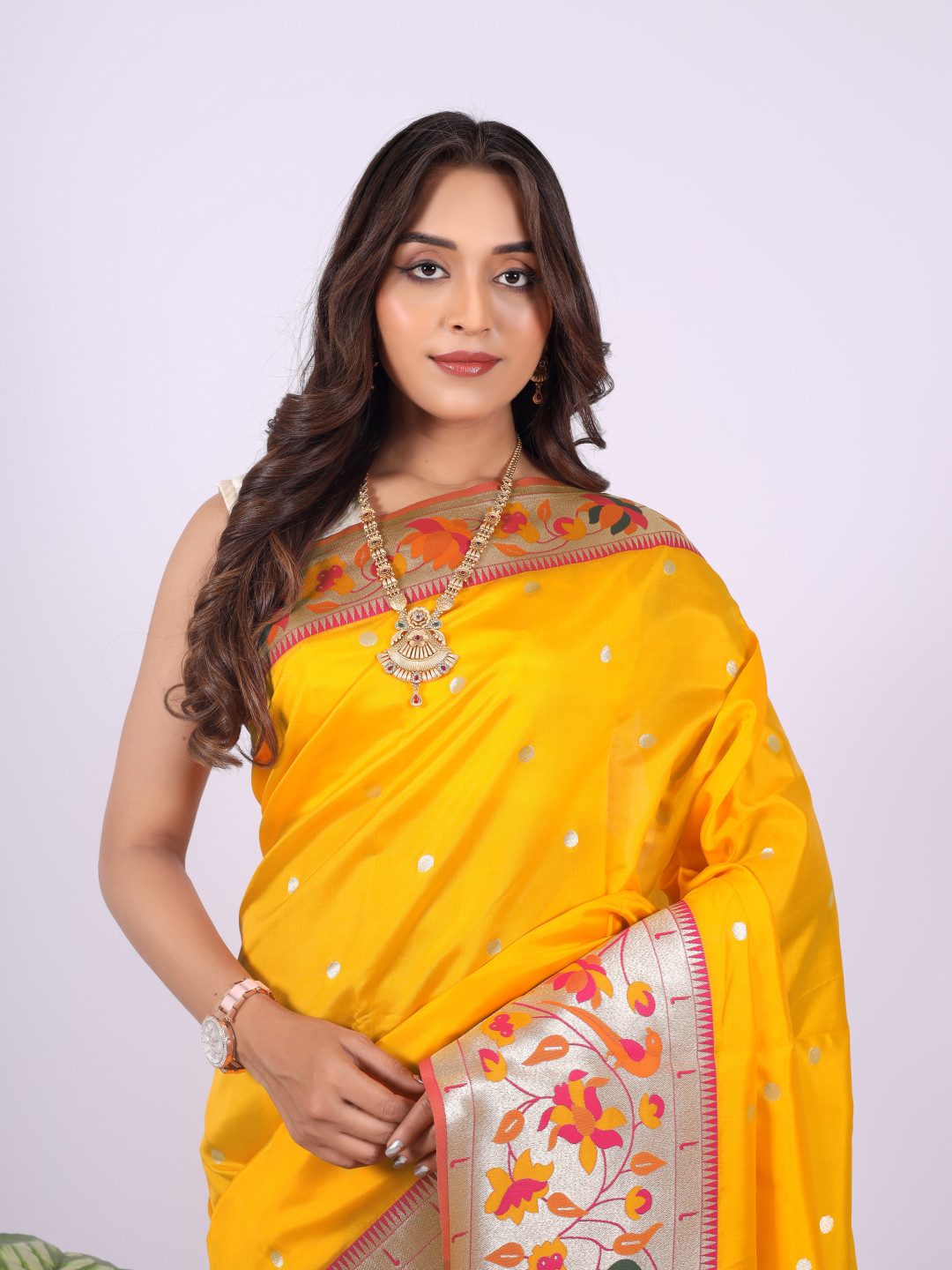 Yellow color paithani silk saree with zari woven work