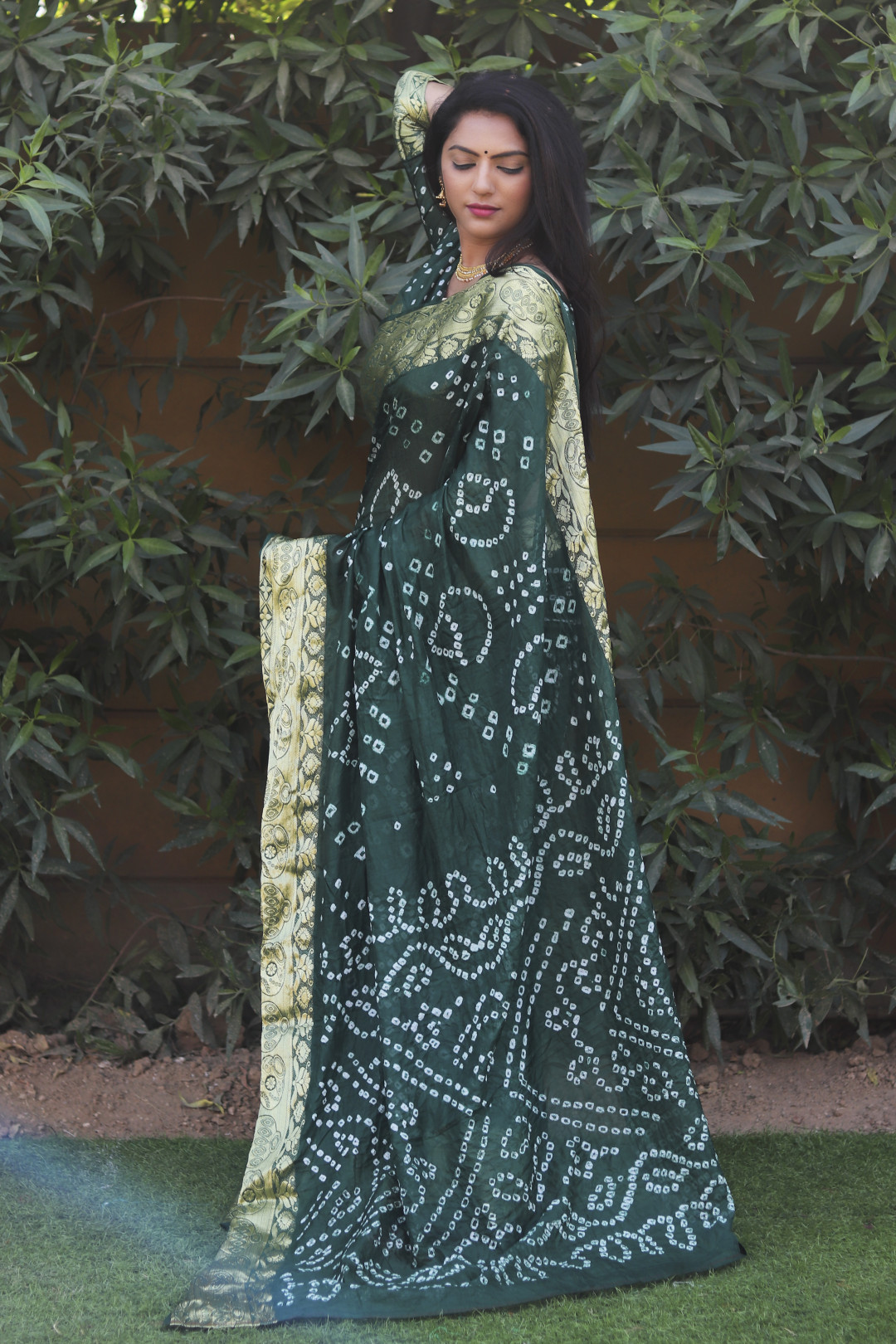 Green color bandhej silk saree with zari weaving work