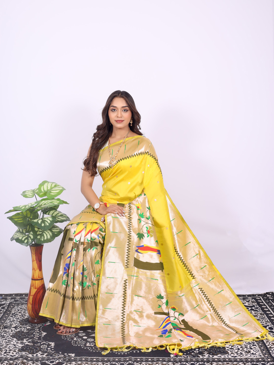 Yellow color paithani silk saree with zari weaving work