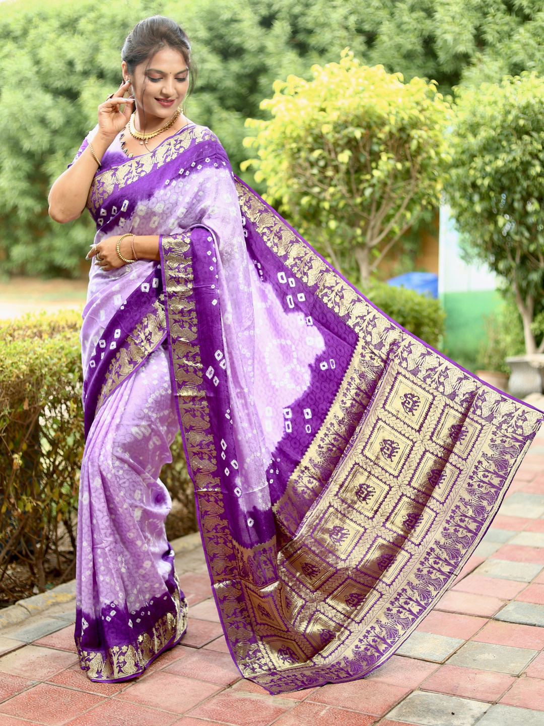 Lavender and purple color bandhej silk saree with zari weaving work