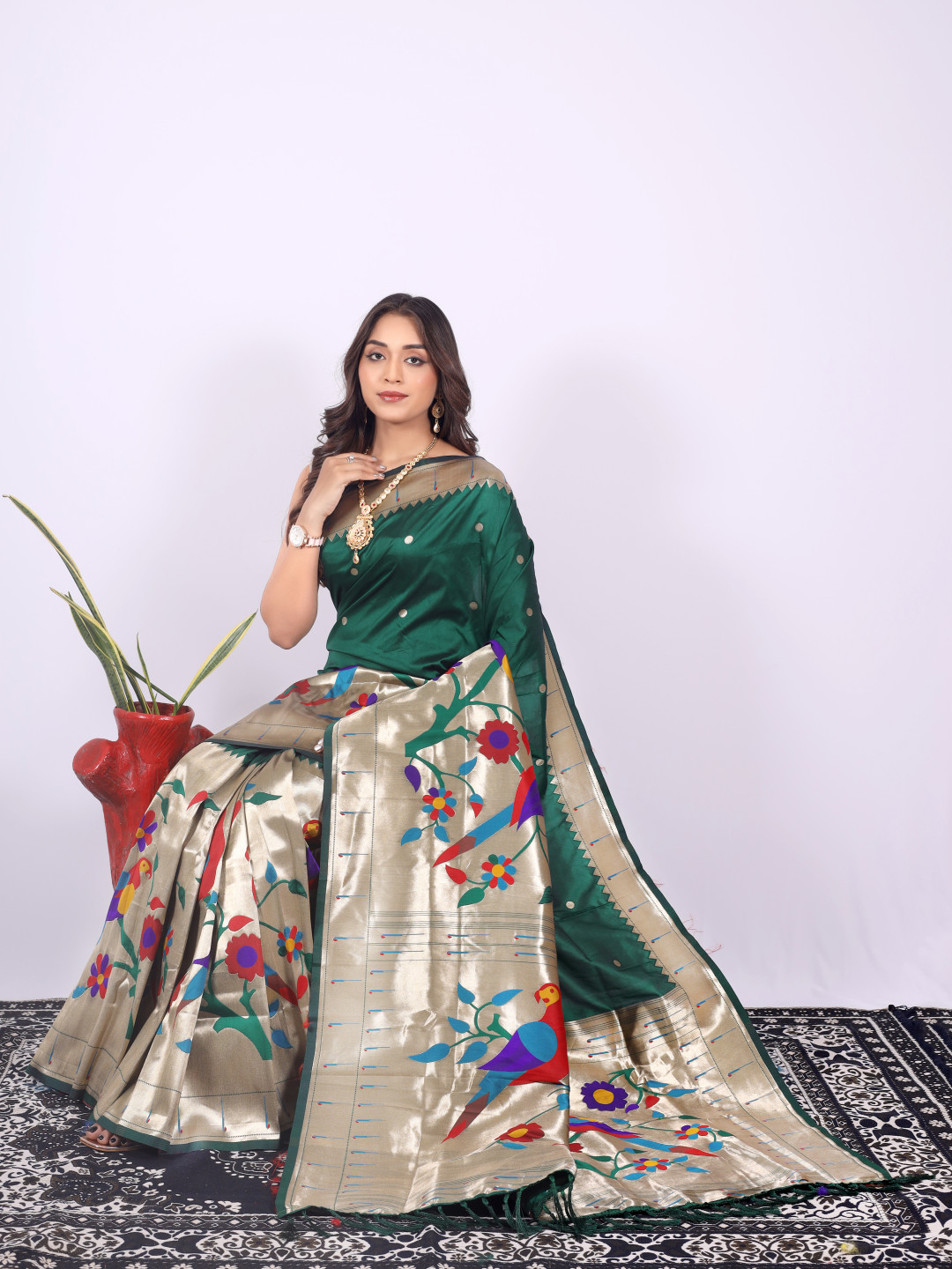 Dark green color paithani silk saree with zari weaving work