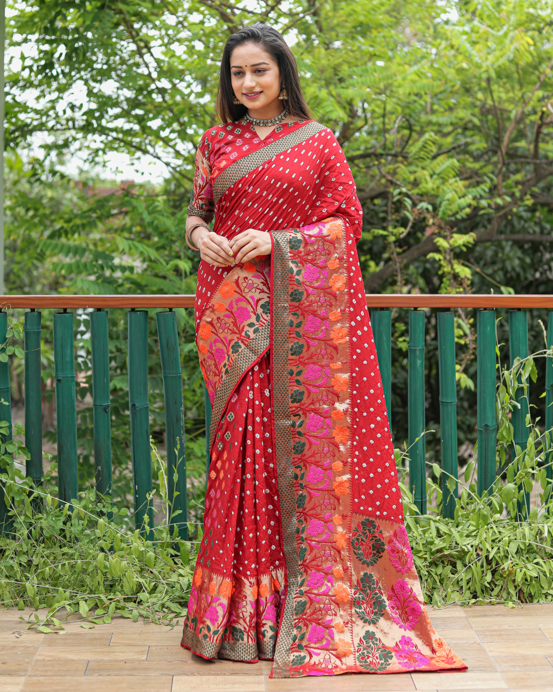 Red color bandhej silk saree with zari weaving work