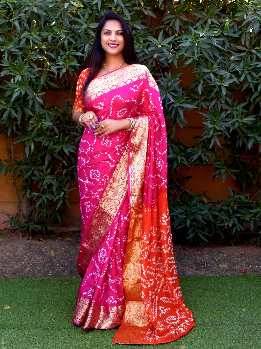 Pink color bandhej silk saree with zari weaving work