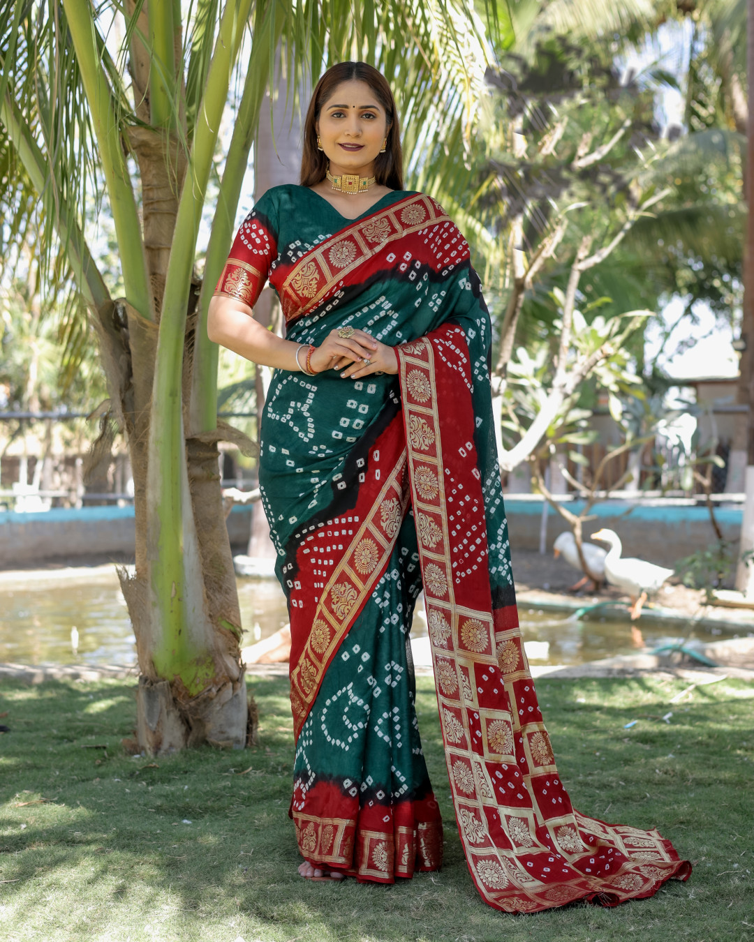 Green and red color bandhej silk saree with zari weaving work