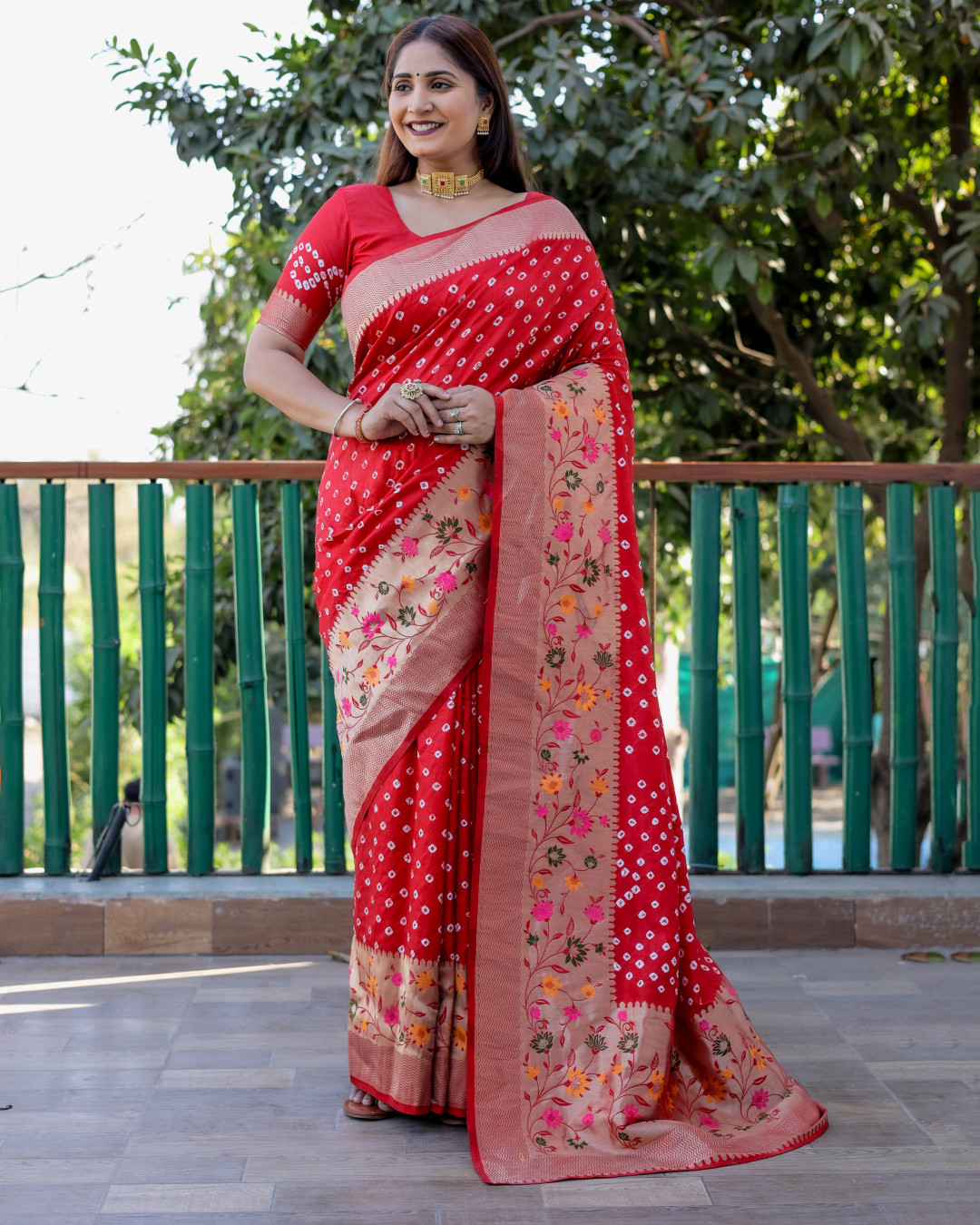 Red color bandhej silk saree with zari weaving work