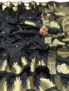 Black color lichi silk saree with golden zari weaving work