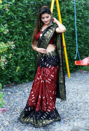 Red with black color hand bandhej bandhani saree with zari weaving border