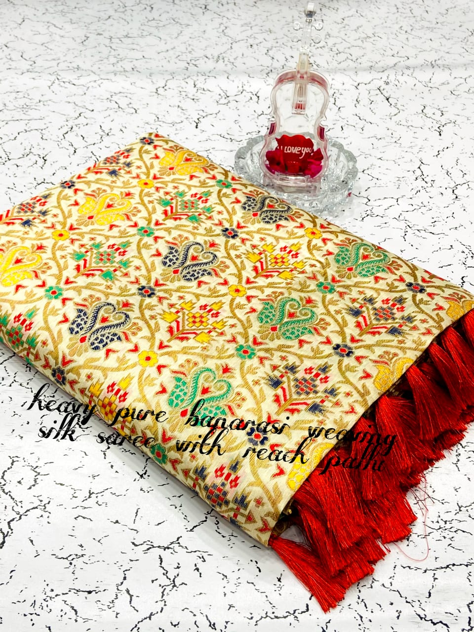 Off white color heavy banarasi weaving silk saree with beautiful tassel