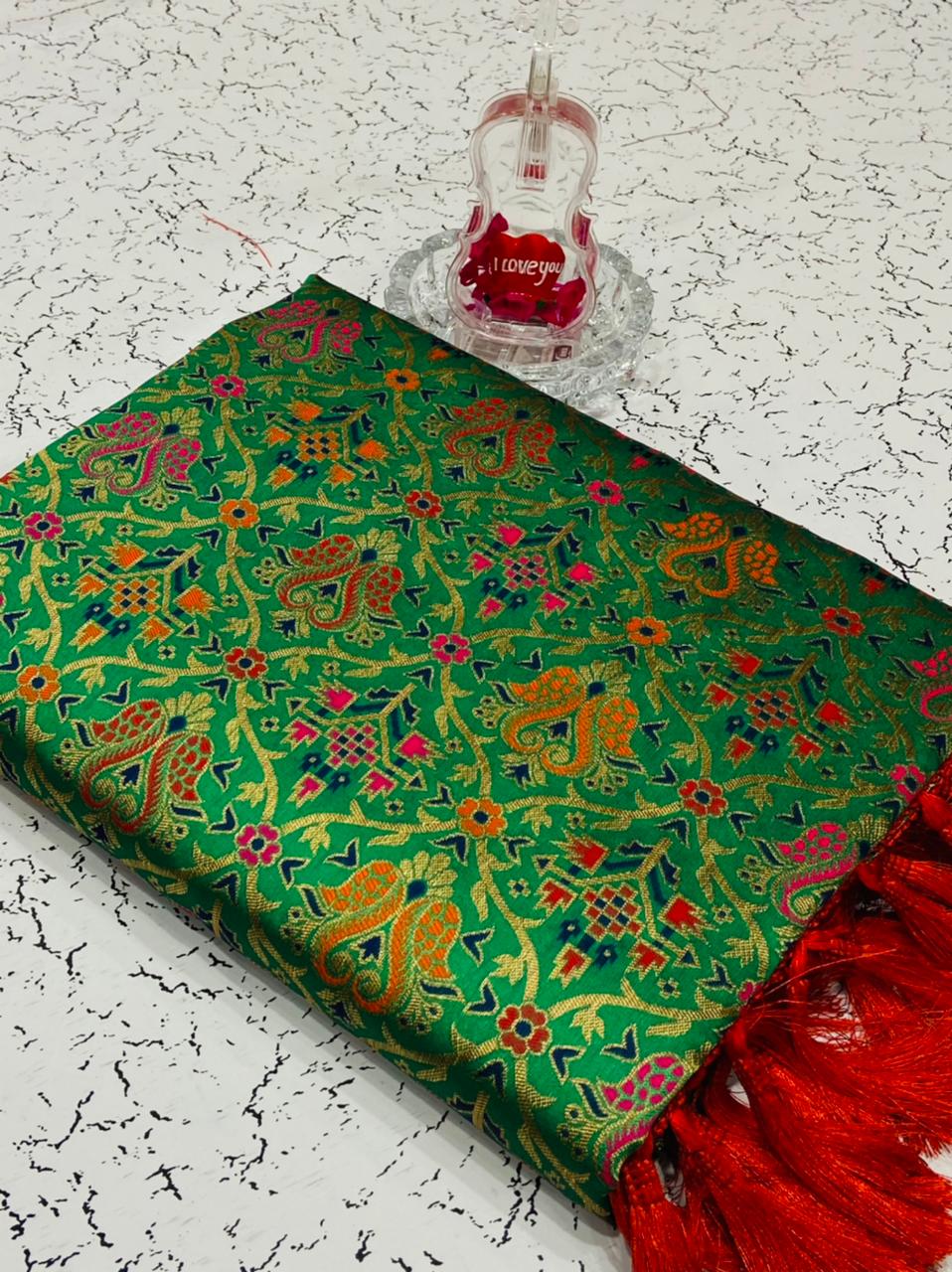 Green color heavy banarasi weaving silk saree with beautiful tassel