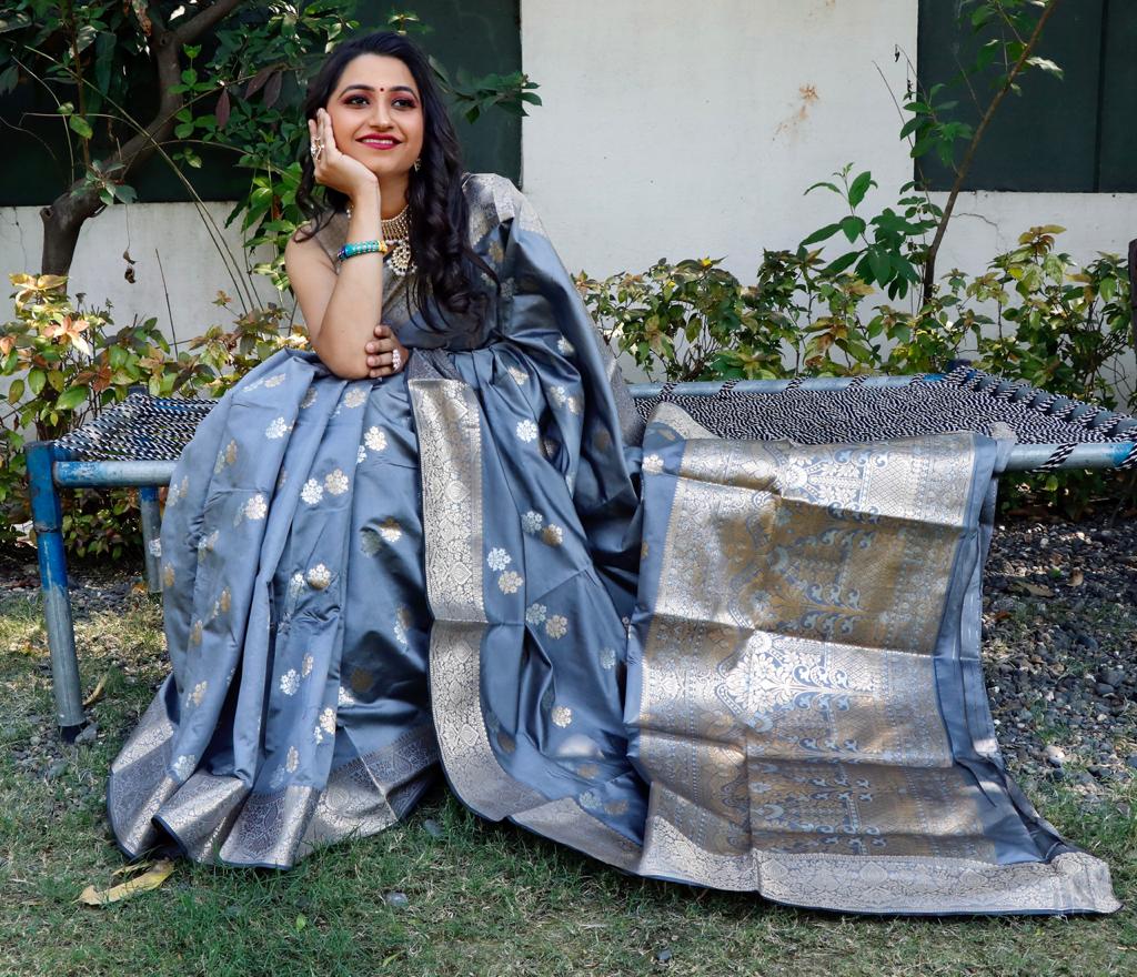 Gray color soft lichi silk saree with silver and golden zari weaving work