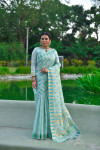 Sea green color tussar silk saree with zari woven border