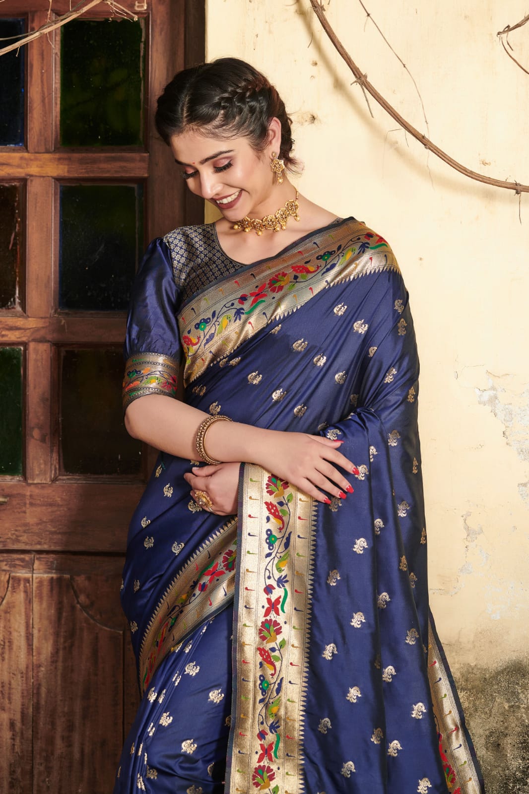 Navy blue color paithani silk saree with zari woven work