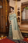 Sea green color soft organza silk saree with zari weaving work
