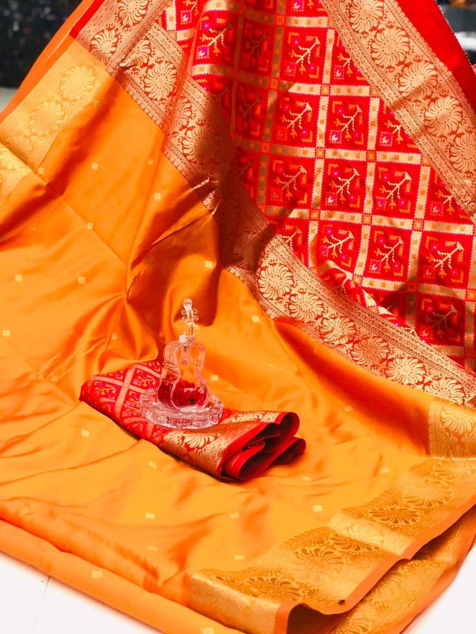 Orange color soft banarasi silk saree with zari weaving work