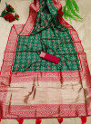 Dark green color patola silk saree with zari woven work