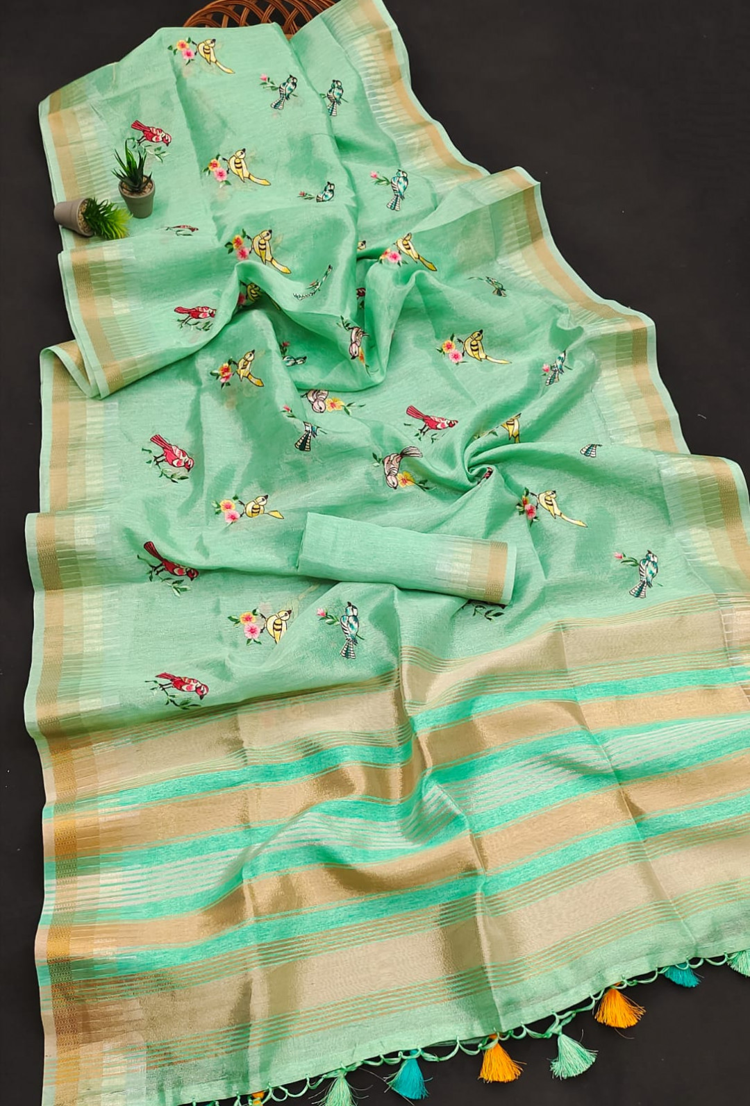 Sea green color tissue silk saree with embroidered work
