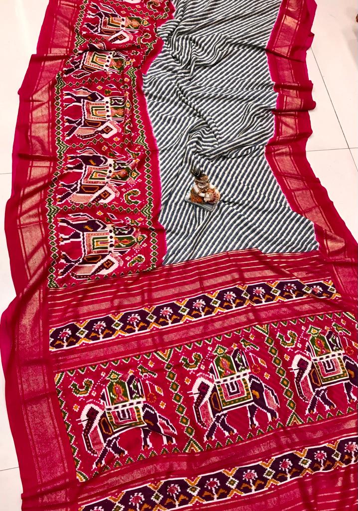 Rani pink color pashmina silk saree with patola design