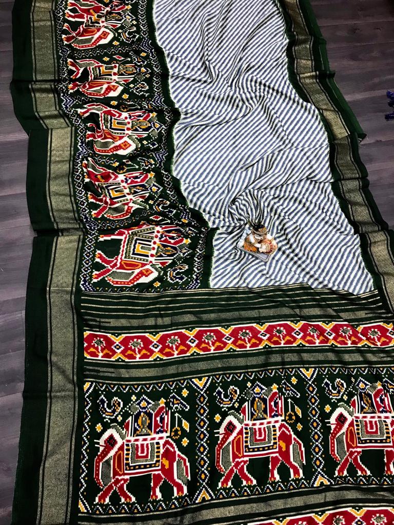 Dark green color pashmina silk saree with patola design