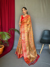 Peach color tissue silk saree with zari weaving work