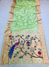 Pista Green color paithani silk saree with zari weaving work