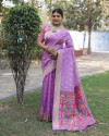Lavender color soft organza silk saree with zari weaving work