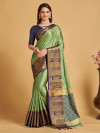 Pista green color lichi silk saree with zari weaving work