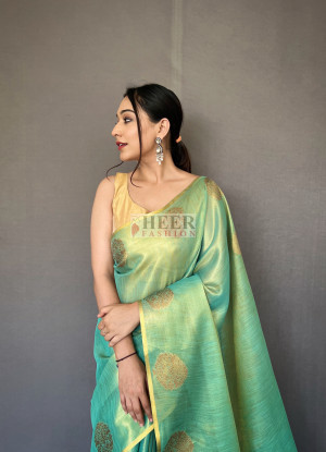 Sea green color tissue silk saree with zari weaving work