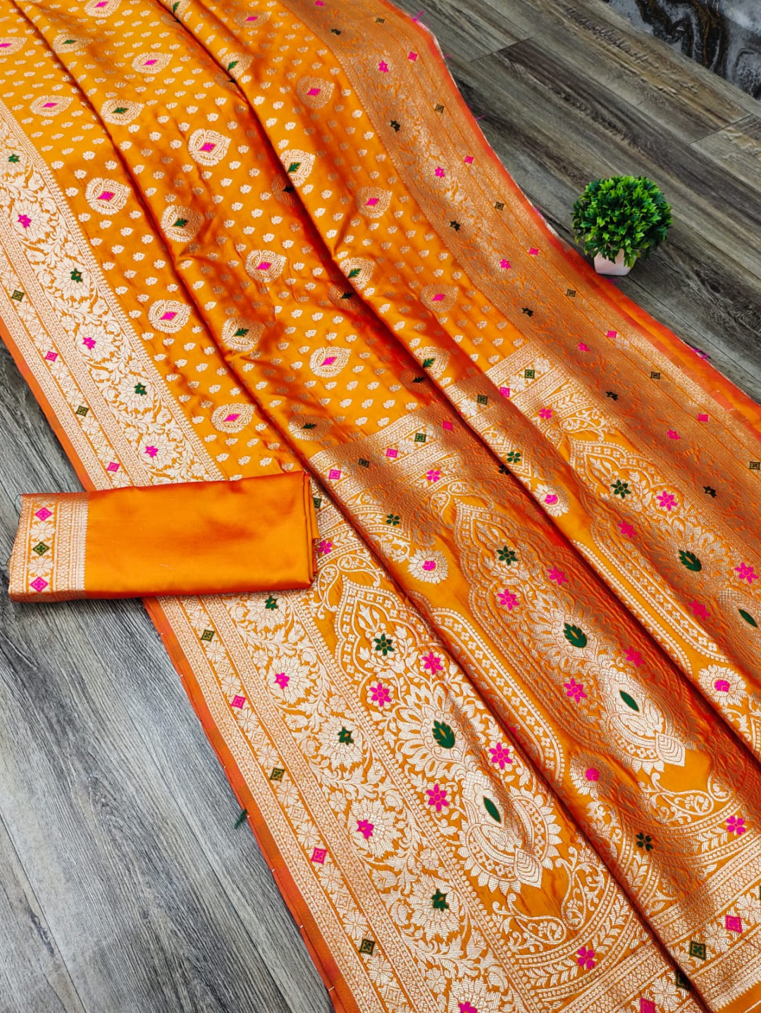 Orange color banarasi silk saree with zari weaving work