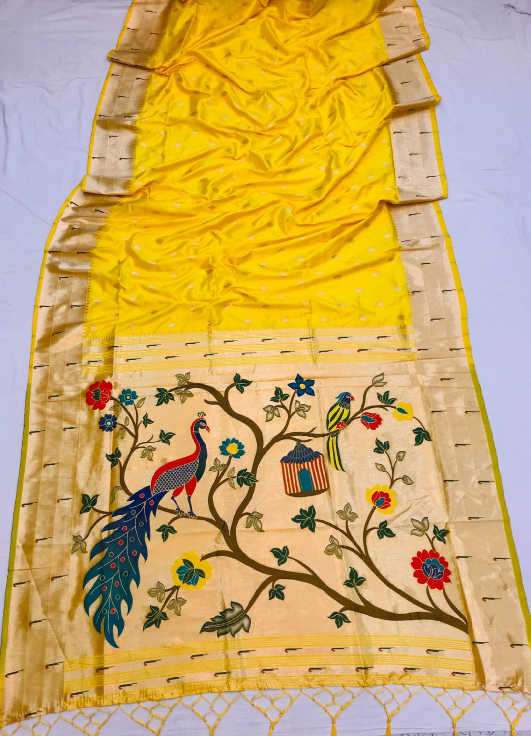 Yellow color paithani silk saree with zari weaving work