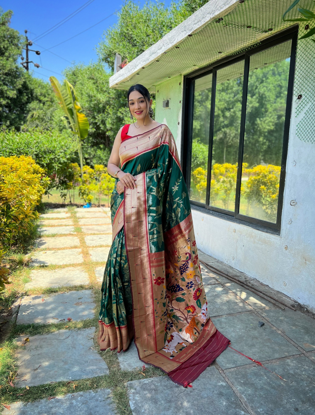 Dark green color paithani silk saree with zari weaving work