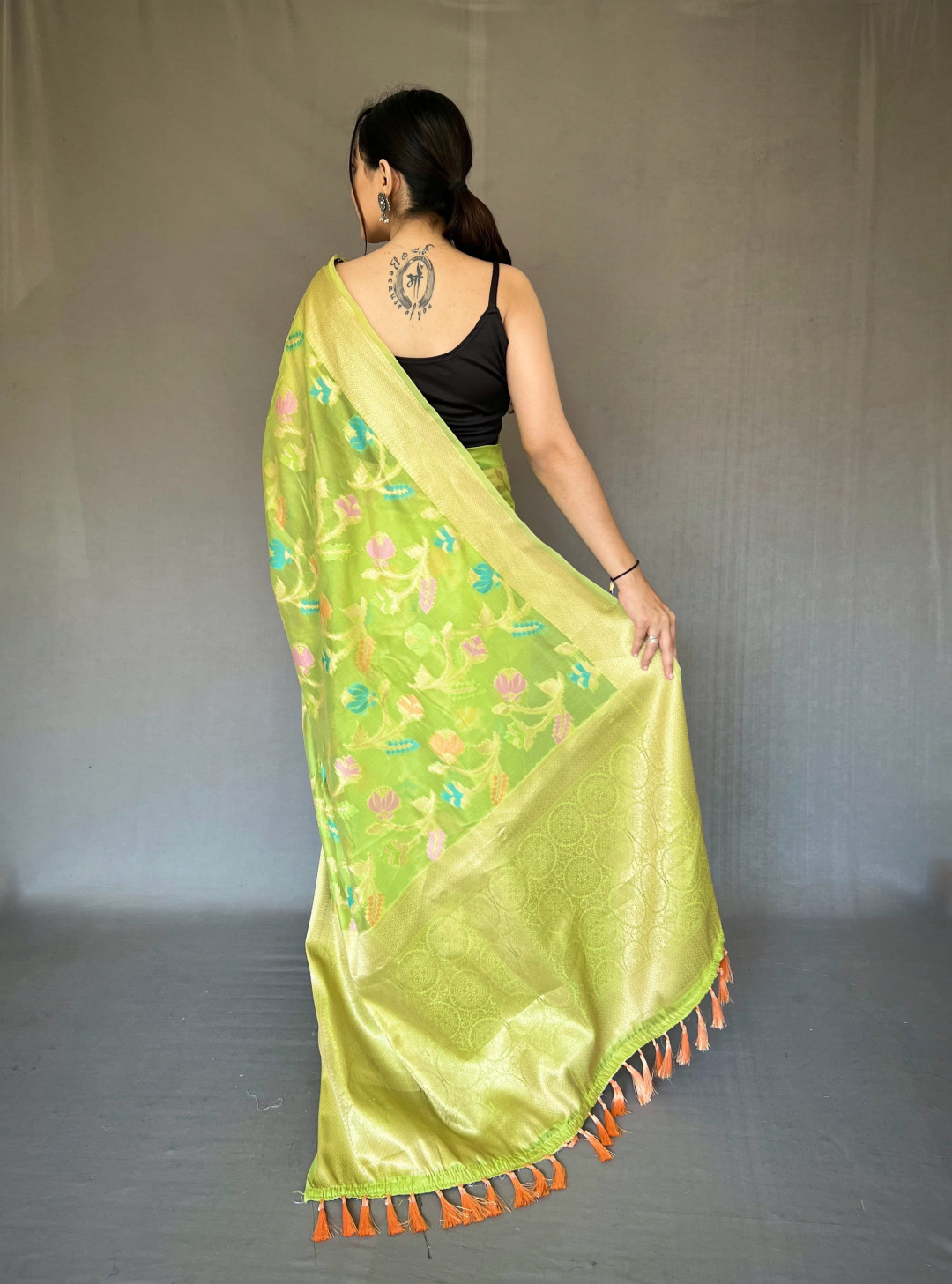 Parrot green color linen silk saree with woven design