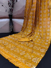 Yellow color soft hand bandhej silk saree