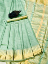 Pista green color soft assam silk saree with zari weaving work
