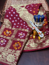 Maroon color hand bandhej silk saree with zari weaving work