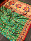 Green color patola saree with beautiful woven design