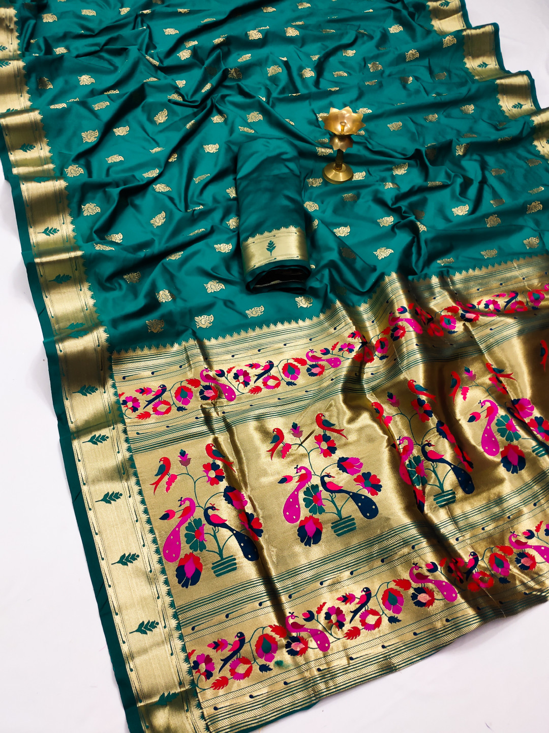 Rama green color paithani silk saree with zari weaving work