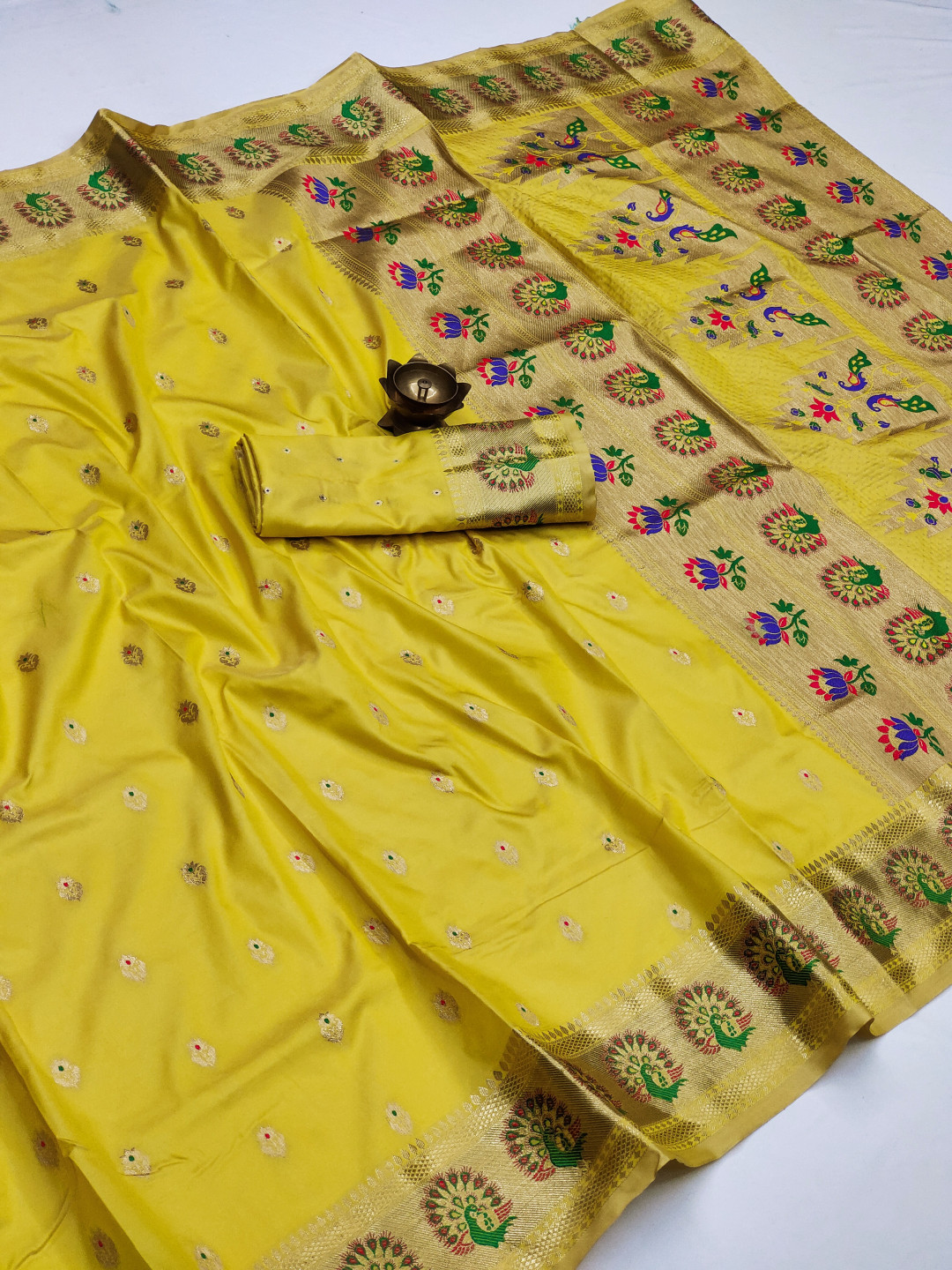 Lemon yellow color paithani silk saree with zari weaving work