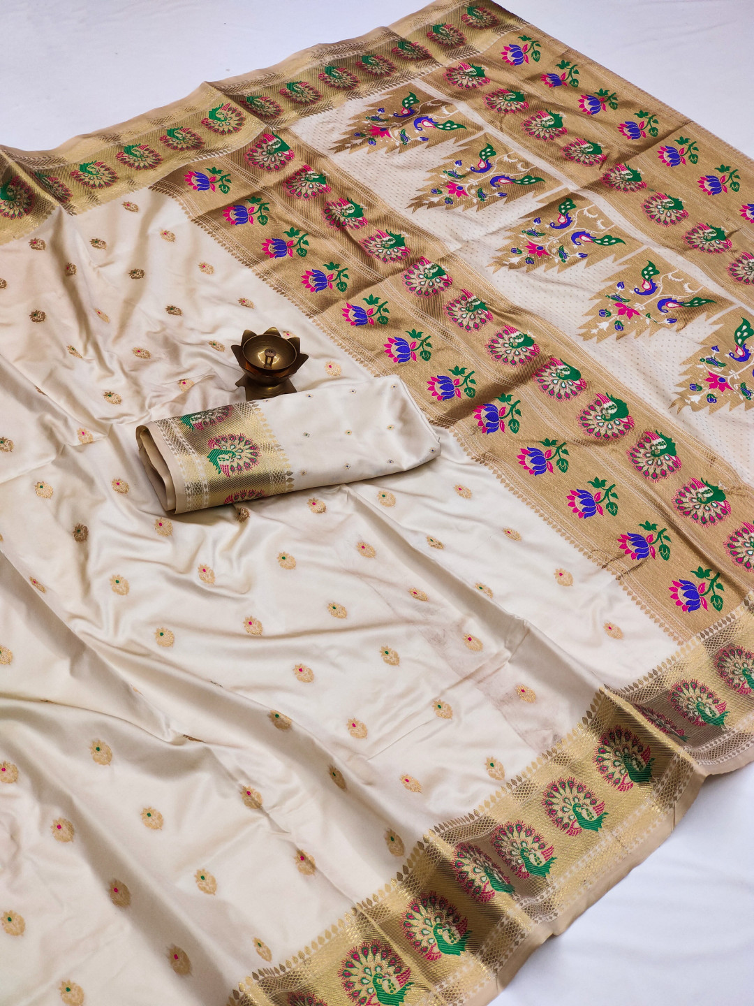 Off white color paithani silk saree with zari weaving work