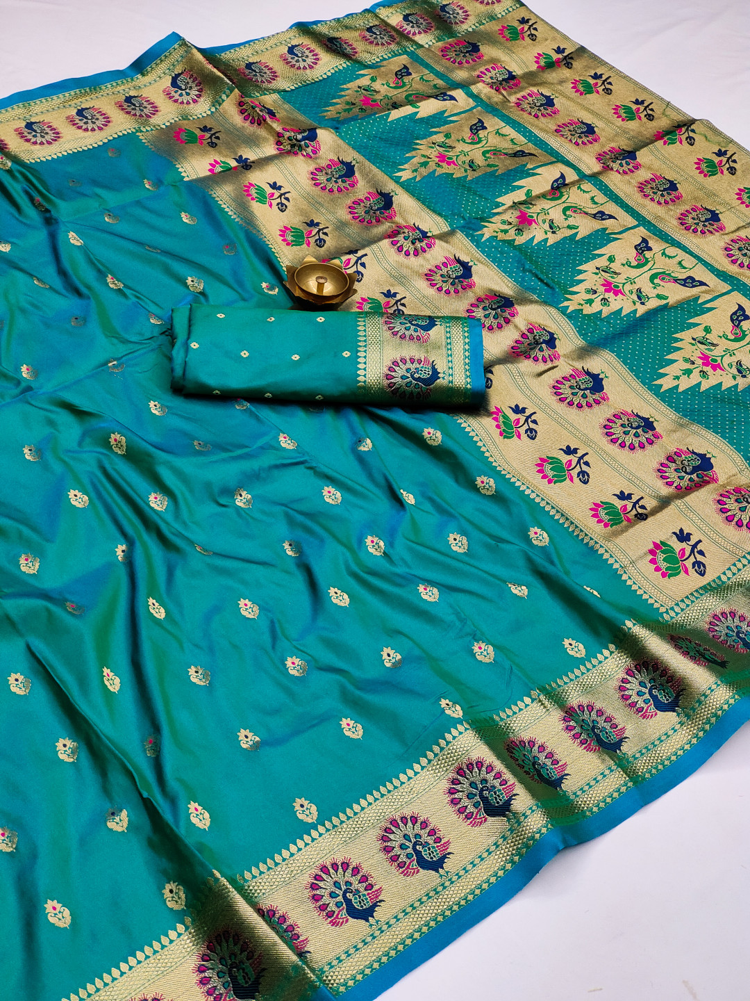 Rama green color paithani silk saree with zari weaving work