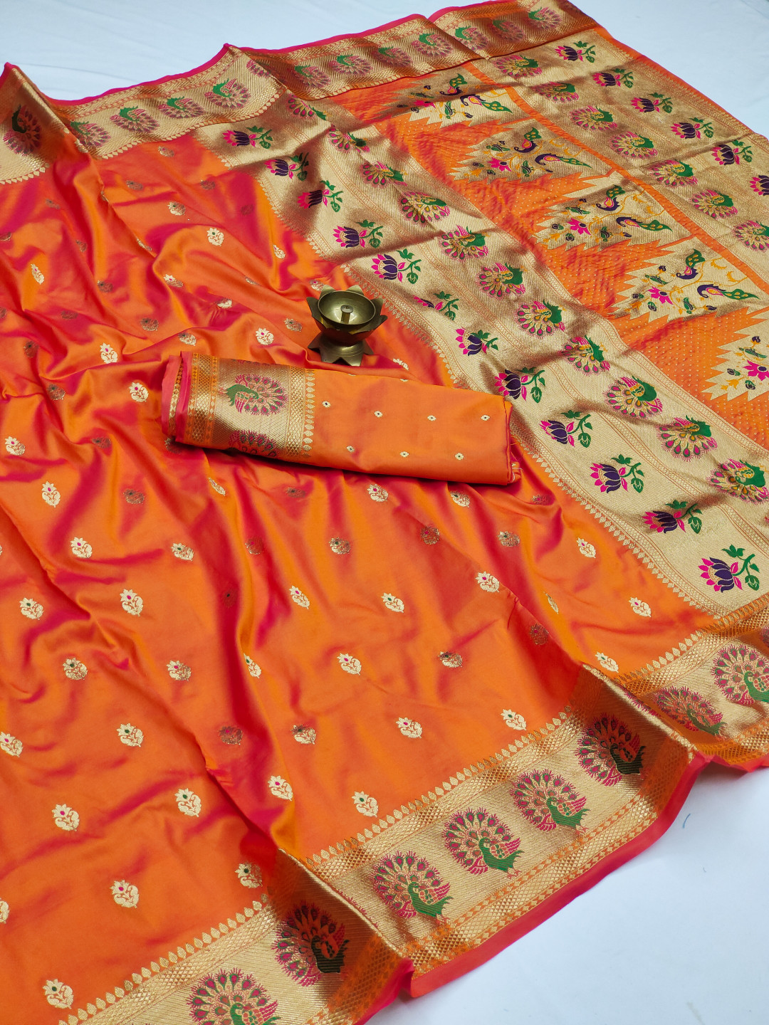 Orange color paithani silk saree with zari weaving work