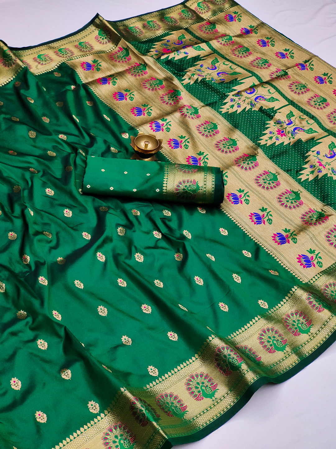 Dark green color paithani silk saree with zari weaving work
