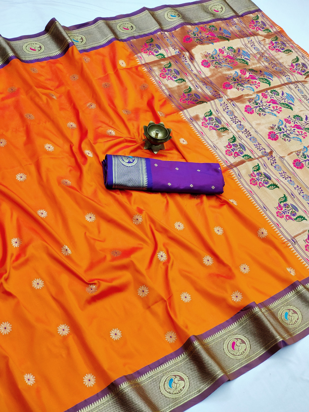 Orange color paithani silk saree with zari weaving work