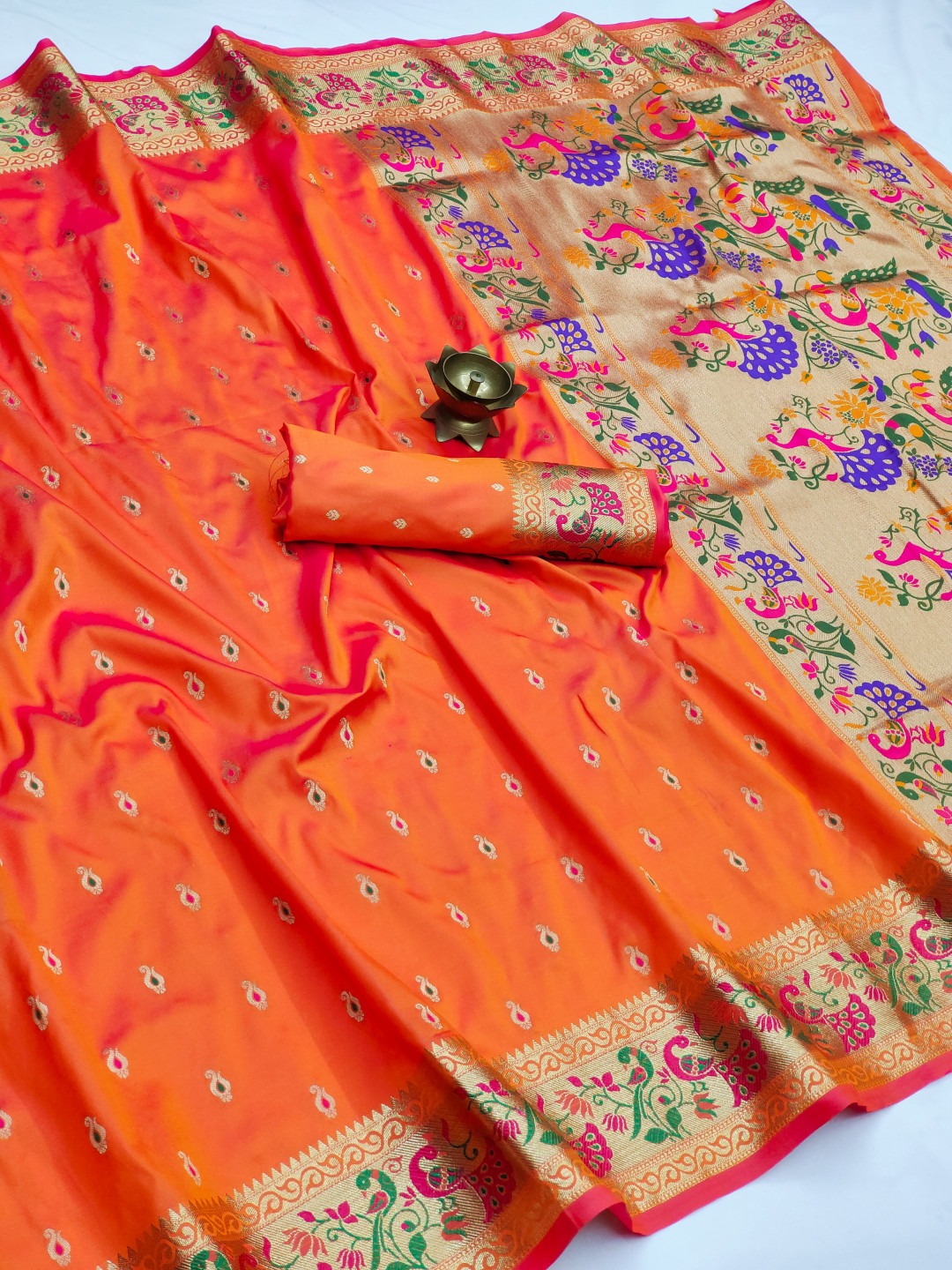 Orange color paithani silk saree with zari weaving work