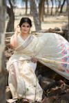 Cream color pure linen saree with zari woven border and pallu