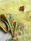 Light yellow color organza silk saree with embroidery work