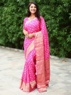 Pink color soft hand bandhej bandhani saree with zari weaving work