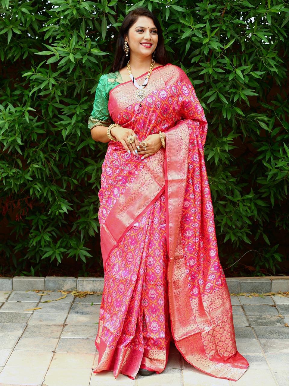 Rani pink color patola silk saree with gold zari weaving work